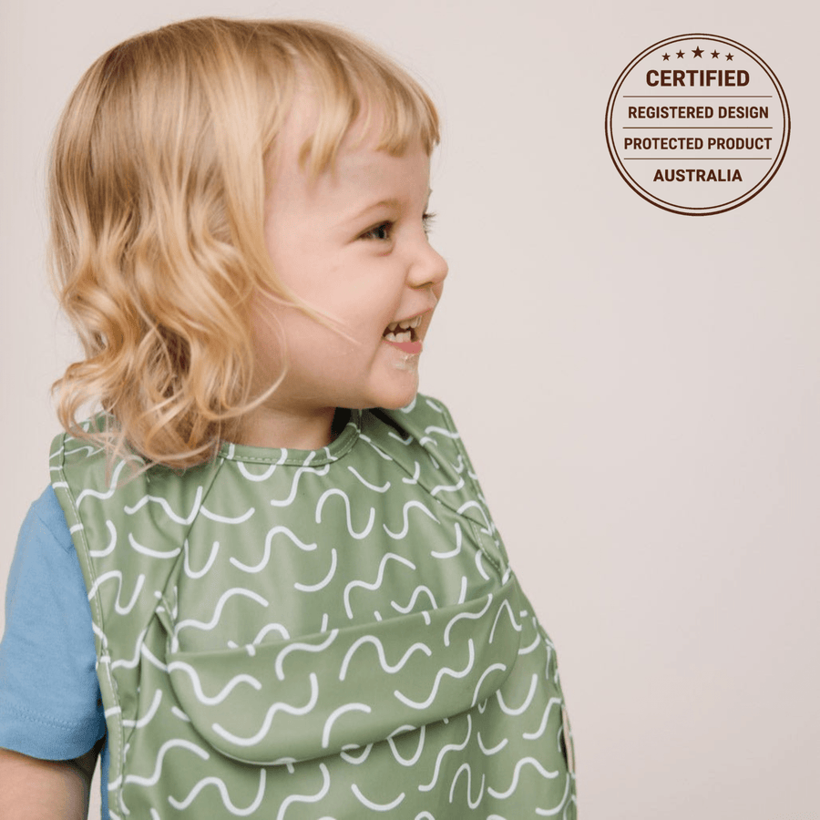 Pistachio Puff Less Mess waterproof baby bib by Abibi, full front coverage that wipes clean for starting solids