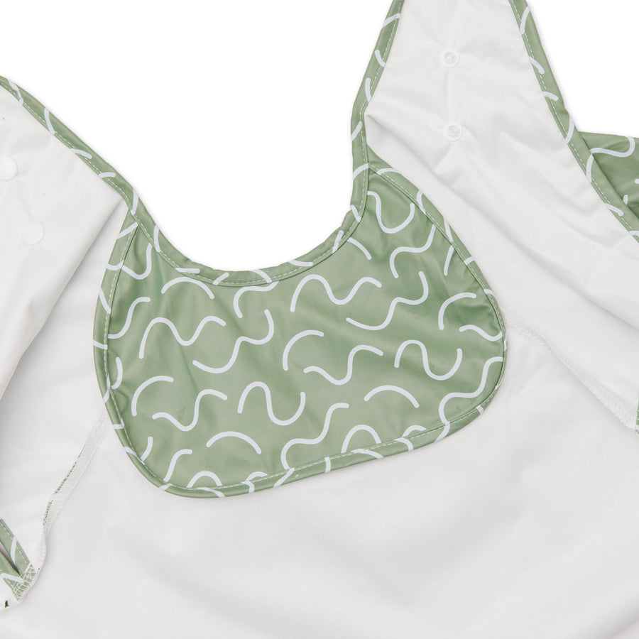 Pistachio Puff green waterproof sleeveless baby feeding smock bib by Abibi - mess proof inner collar flap