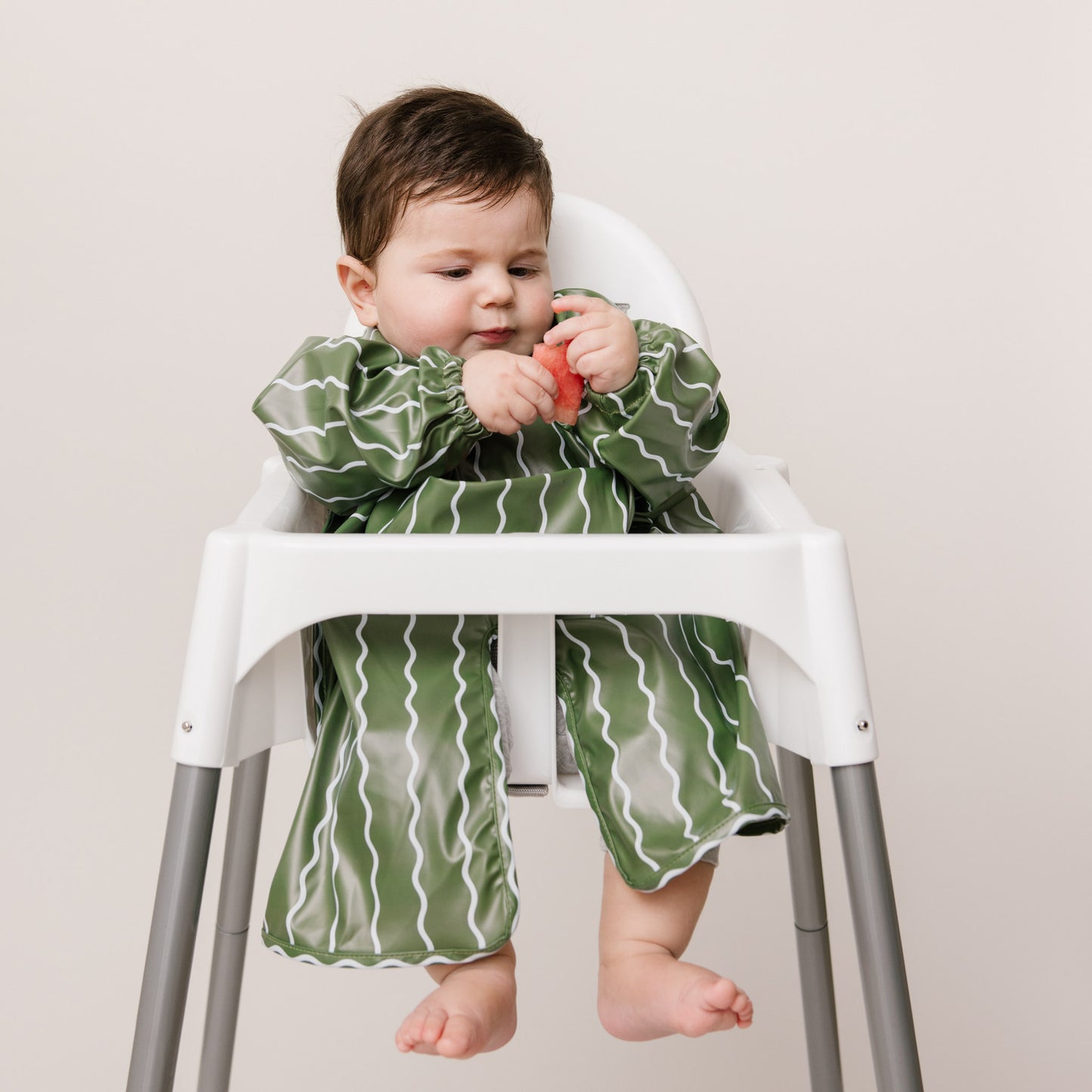 Abibi long sleeve smock bib, bright playful print, keeps clothes clean during mealtimes