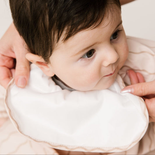 Abibi long sleeve smock bib, bright playful print, keeps clothes clean during mealtimes