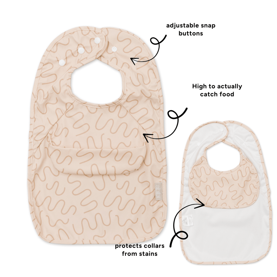 Biscuit Bite Less Mess waterproof baby bib by Abibi, full front coverage that wipes clean for starting solids