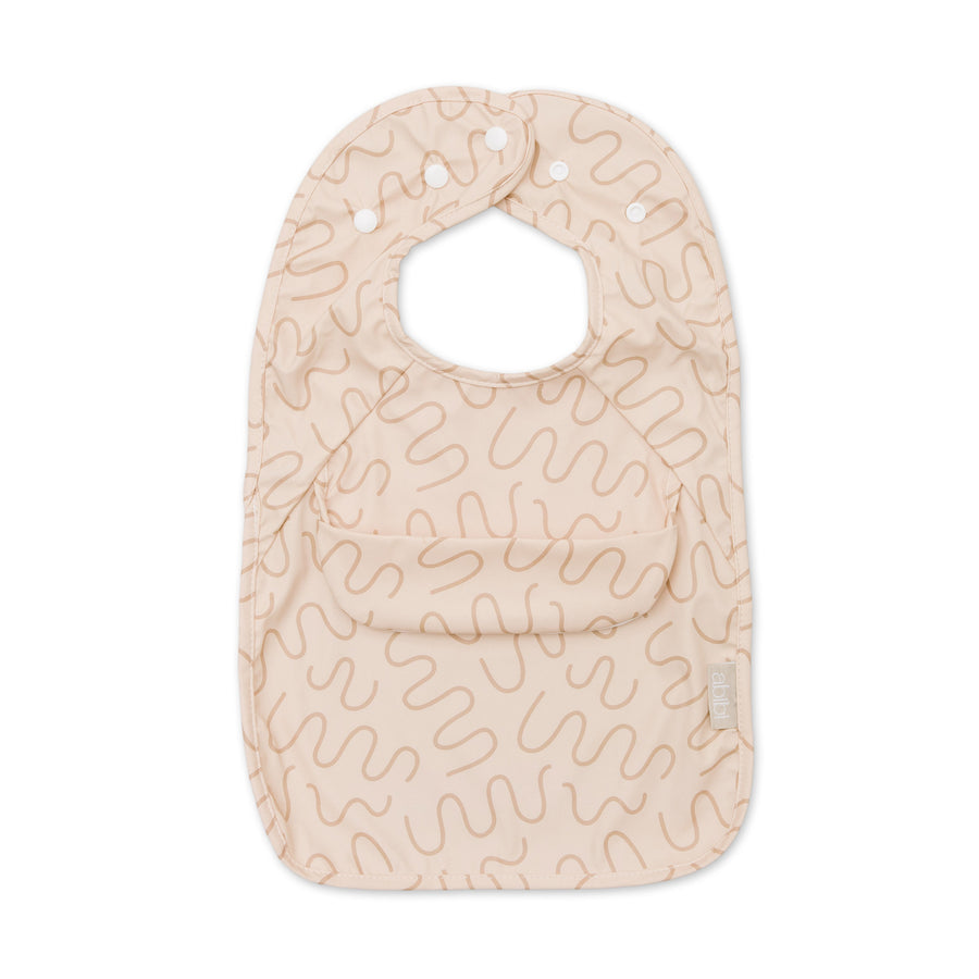 Biscuit Bite beige waterproof sleeveless baby feeding smock bib by Abibi - mess proof inner collar flap