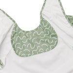 Pistachio Puff green waterproof sleeveless baby feeding smock bib by Abibi - mess proof inner collar flap