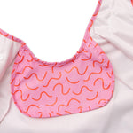 Strawberry Smudge pink waterproof short sleeve baby feeding smock by Abibi - mess proof inner collar flap
